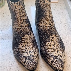 Calvin Klein “Eunice” Snakeskin-look ankle booties